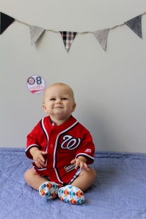 Aiden in Nationals jersey with eight month sticker